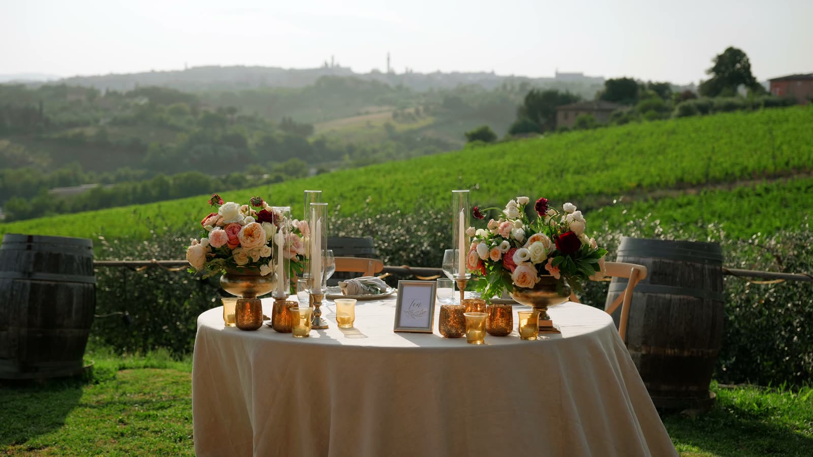 A dressed table for two with flowers and candles